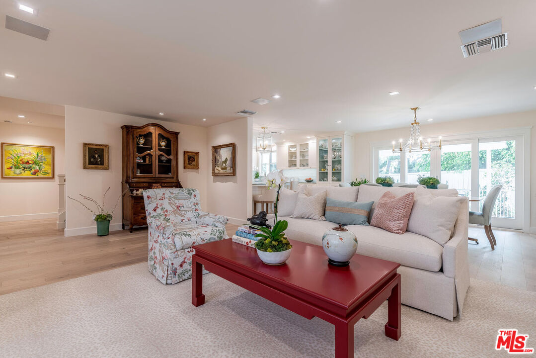 10821 Savona Road Los Angeles, CA 90077 - Photo 6 of 26 a living room with furniture and wooden floor