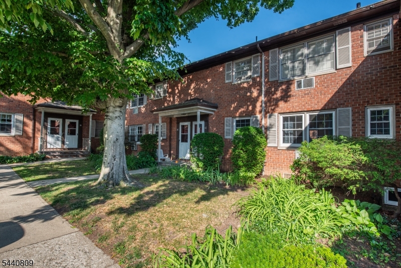 206 Main Street, Unit 42A Millburn, NJ 07041 - Photo 3 of 21 front view of a house with a yard