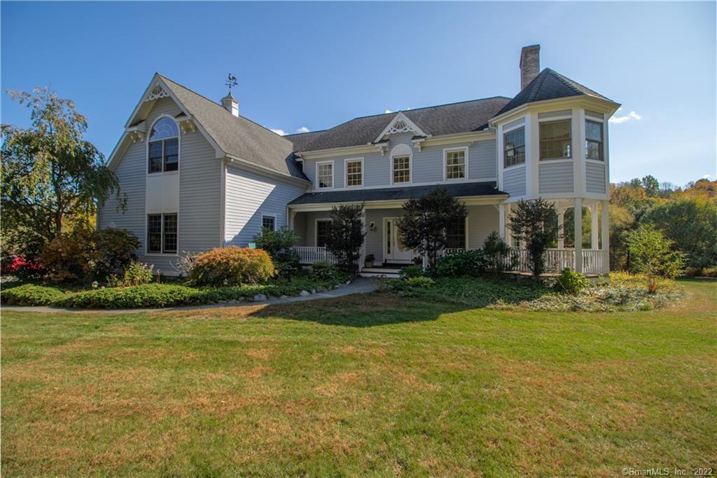 55 Pond Brook Road Newtown, CT 06470 - Photo 1 of 1 a front view of a house with garden