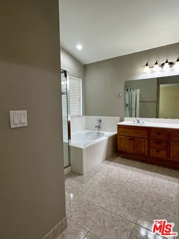 a bathroom with a bathtub and a sink