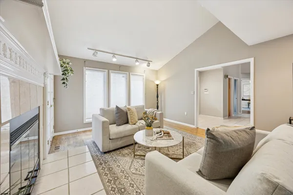 a living room with furniture and a fireplace