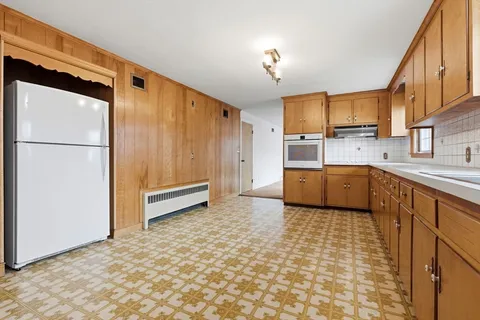 a view of a kitchen with electric appliances