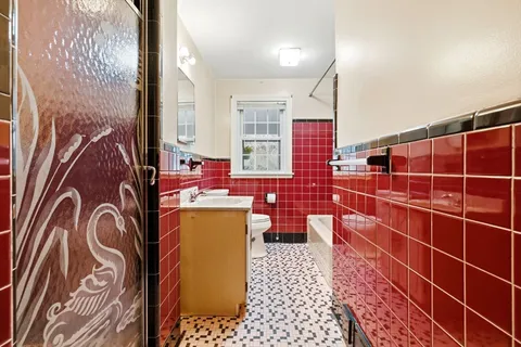 a bathroom with a sink a bathtub and a shower