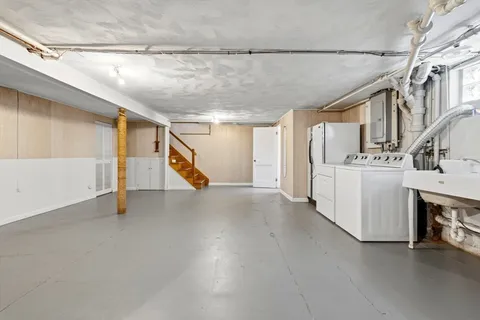 a view of a storage & utility room and stairs