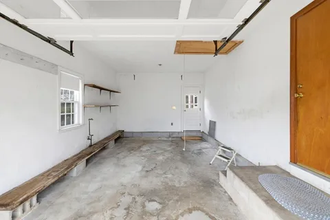 a view of a room with rack and windows