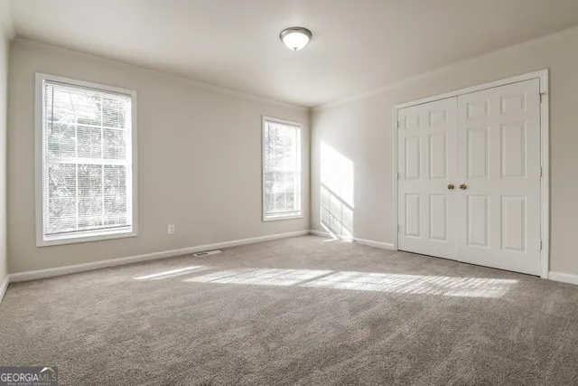 an empty room with windows