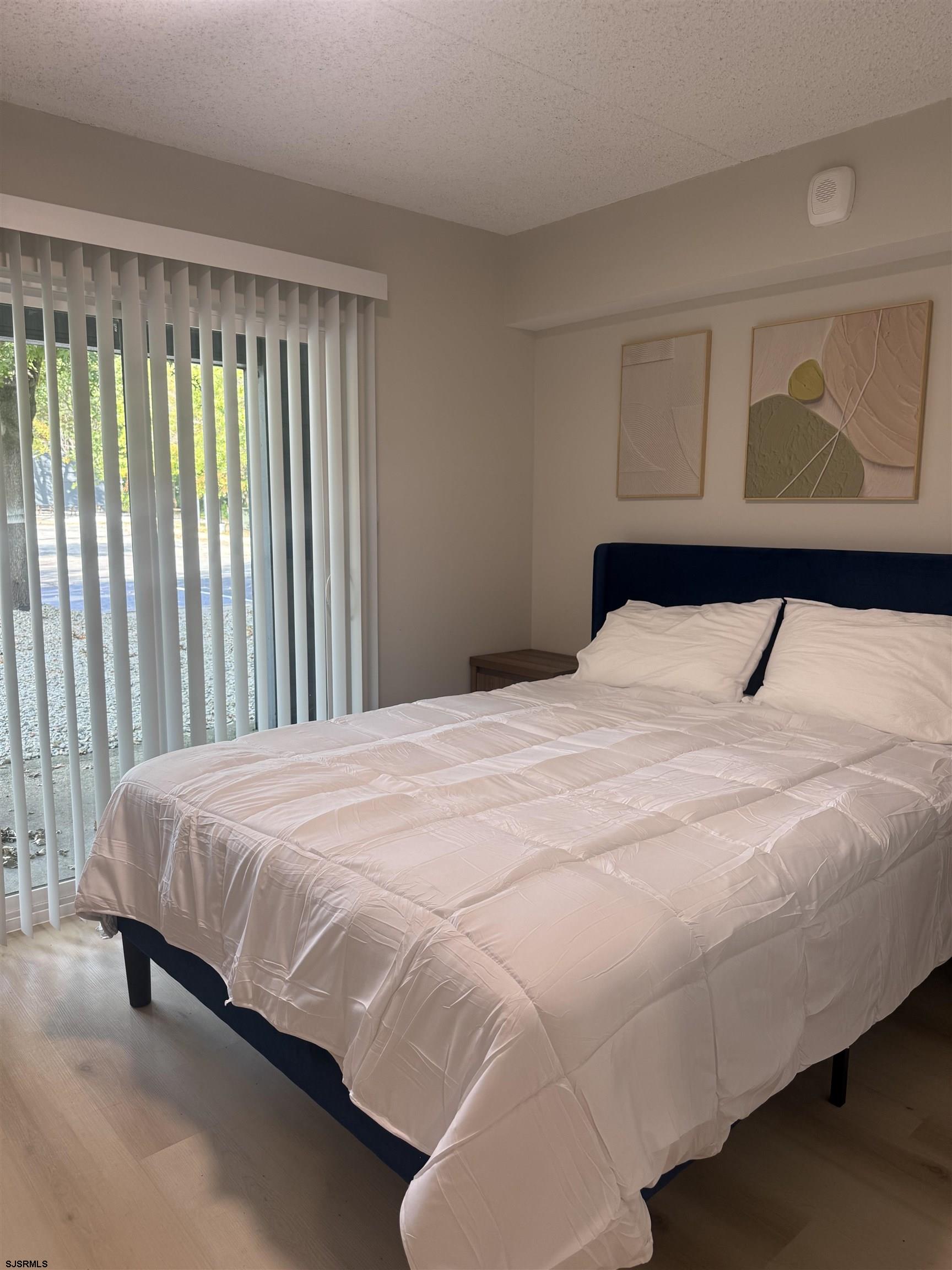 2580 Tilton Road, Unit 112 MODEL Egg Harbor Township, NJ 08234 - Photo 11 of 15 a bedroom with a bed and window