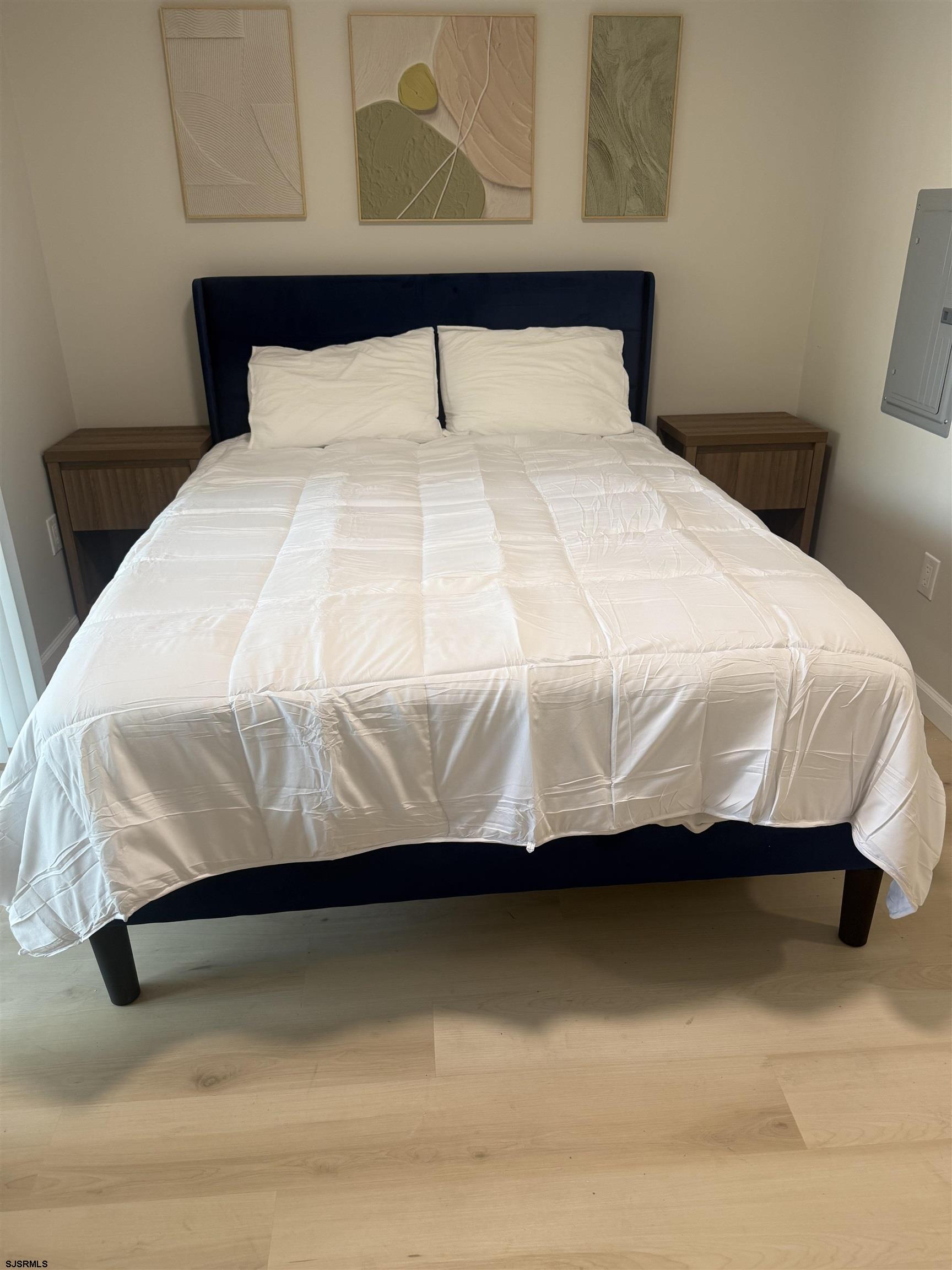 2580 Tilton Road, Unit 112 MODEL Egg Harbor Township, NJ 08234 - Photo 15 of 15 a bedroom with a bed and dresser
