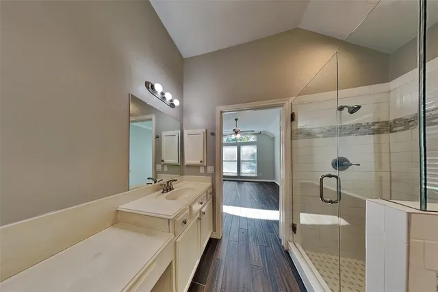 a en suite bathroom with a sink and a mirror