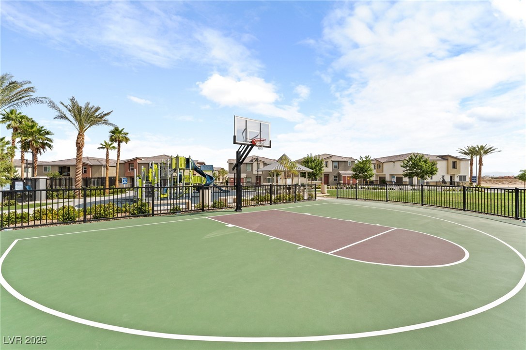 12126 Azure Gate Road, Unit 1 Las Vegas, NV 89183 - Photo 35 of 36 View of basketball court featuring playground community, fence, a residential view, and community basketball court