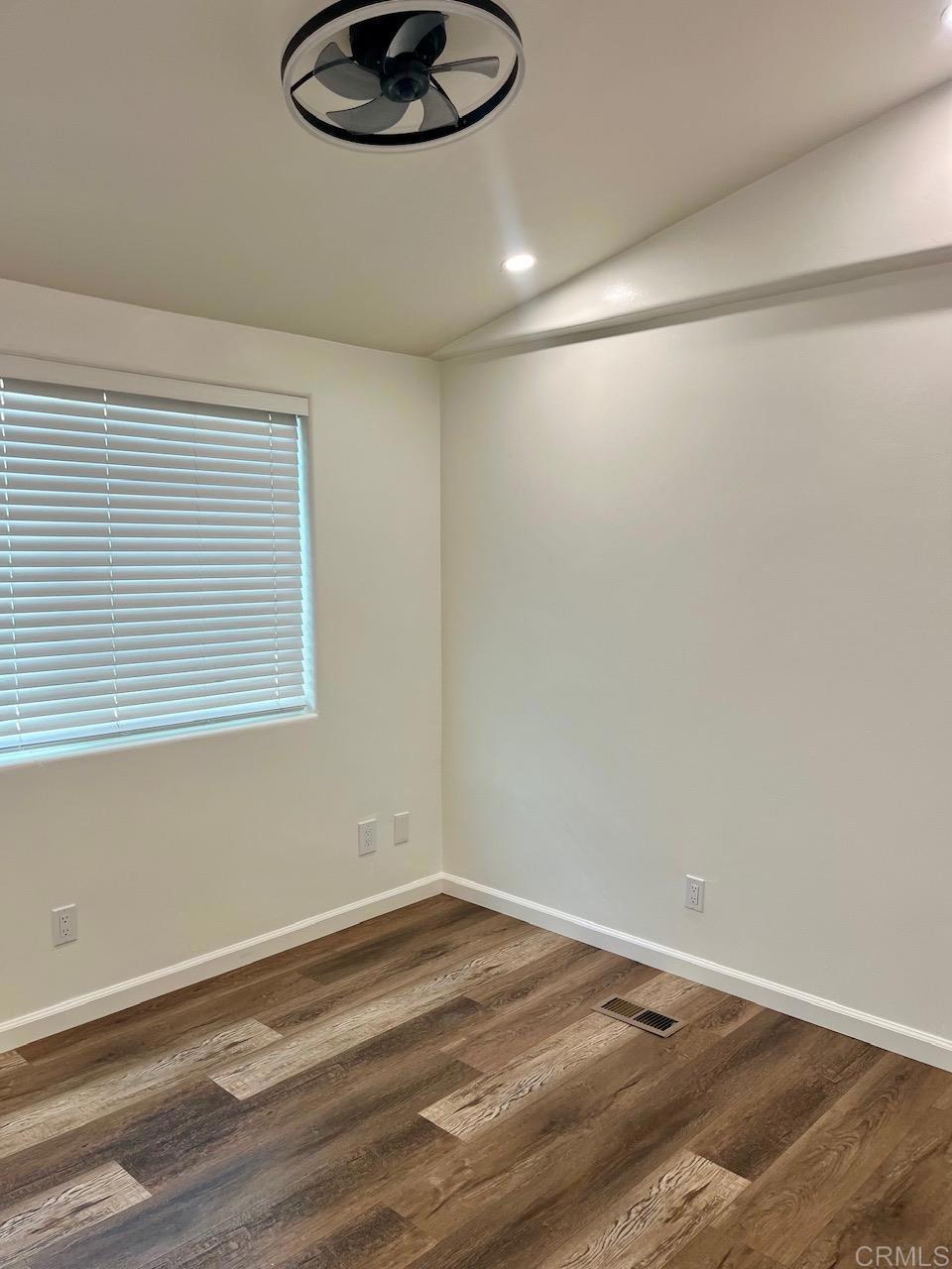 9902 Jamacha Boulevard, Unit 160 Spring Valley, CA 91977 - Photo 11 of 18 a view of a room with a wooden floor and a window