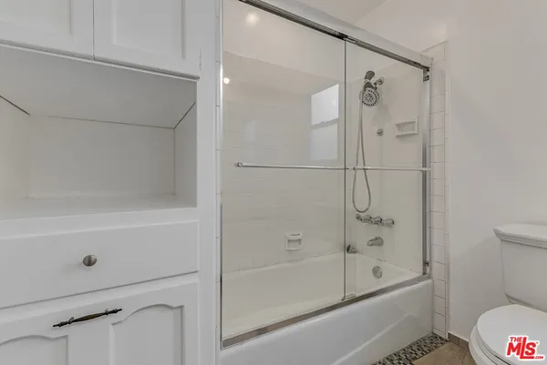a bathroom with a shower and a bathtub