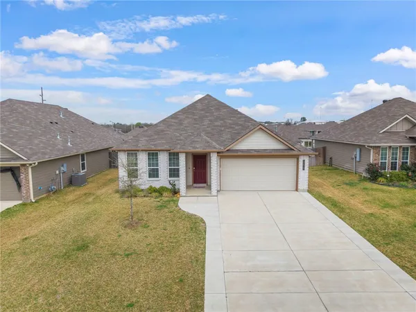 front view of a house with yard