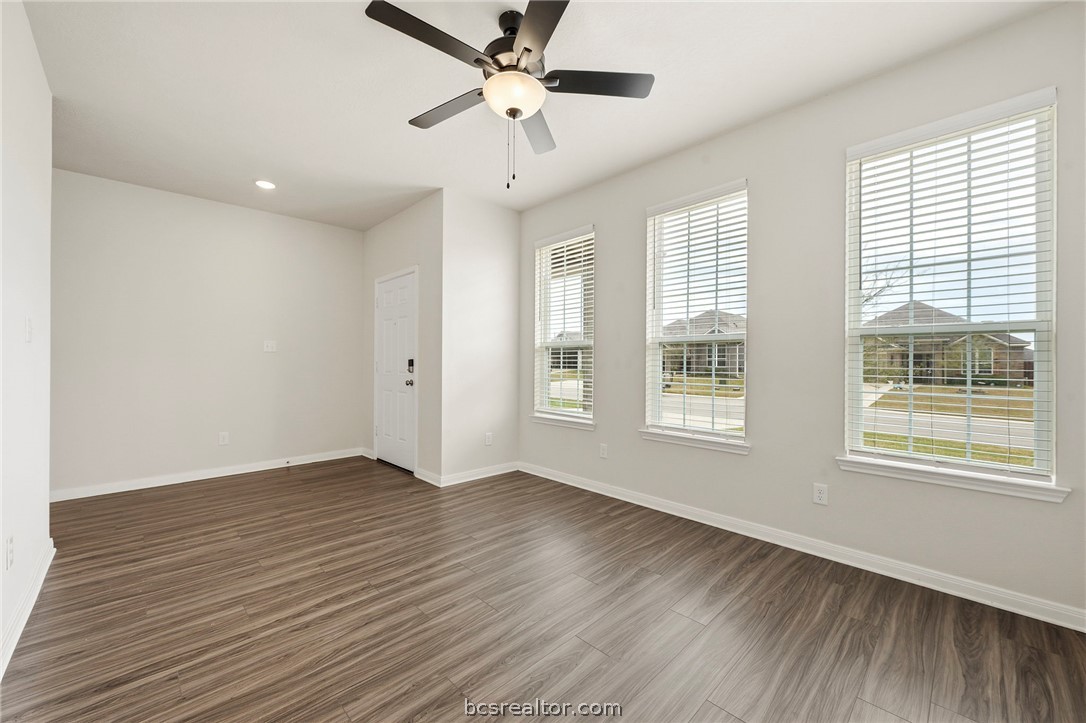 303 Camp Bowie Road Caldwell, TX 77836 - Photo 11 of 25 a view of an empty room with wooden floor and a window