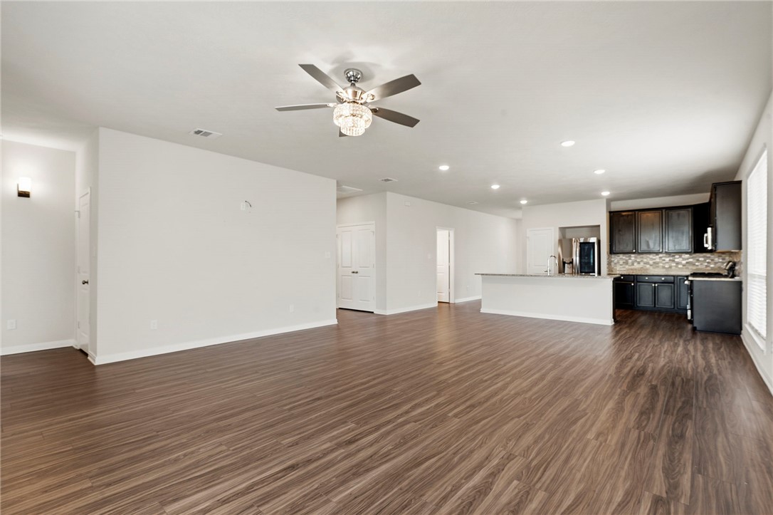 303 Camp Bowie Road Caldwell, TX 77836 - Photo 15 of 25 a view of kitchen with cabinets and wooden floor