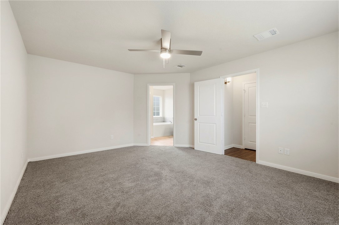 303 Camp Bowie Road Caldwell, TX 77836 - Photo 21 of 25 an empty room with fan and ceiling fan