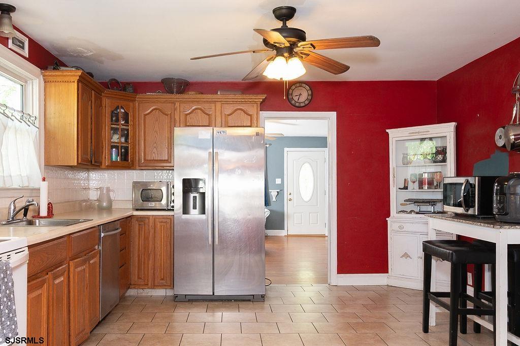 19 South 1st Road Hammonton, NJ 08037 - Photo 13 of 36 a kitchen with stainless steel appliances granite countertop a sink a stove and refrigerator