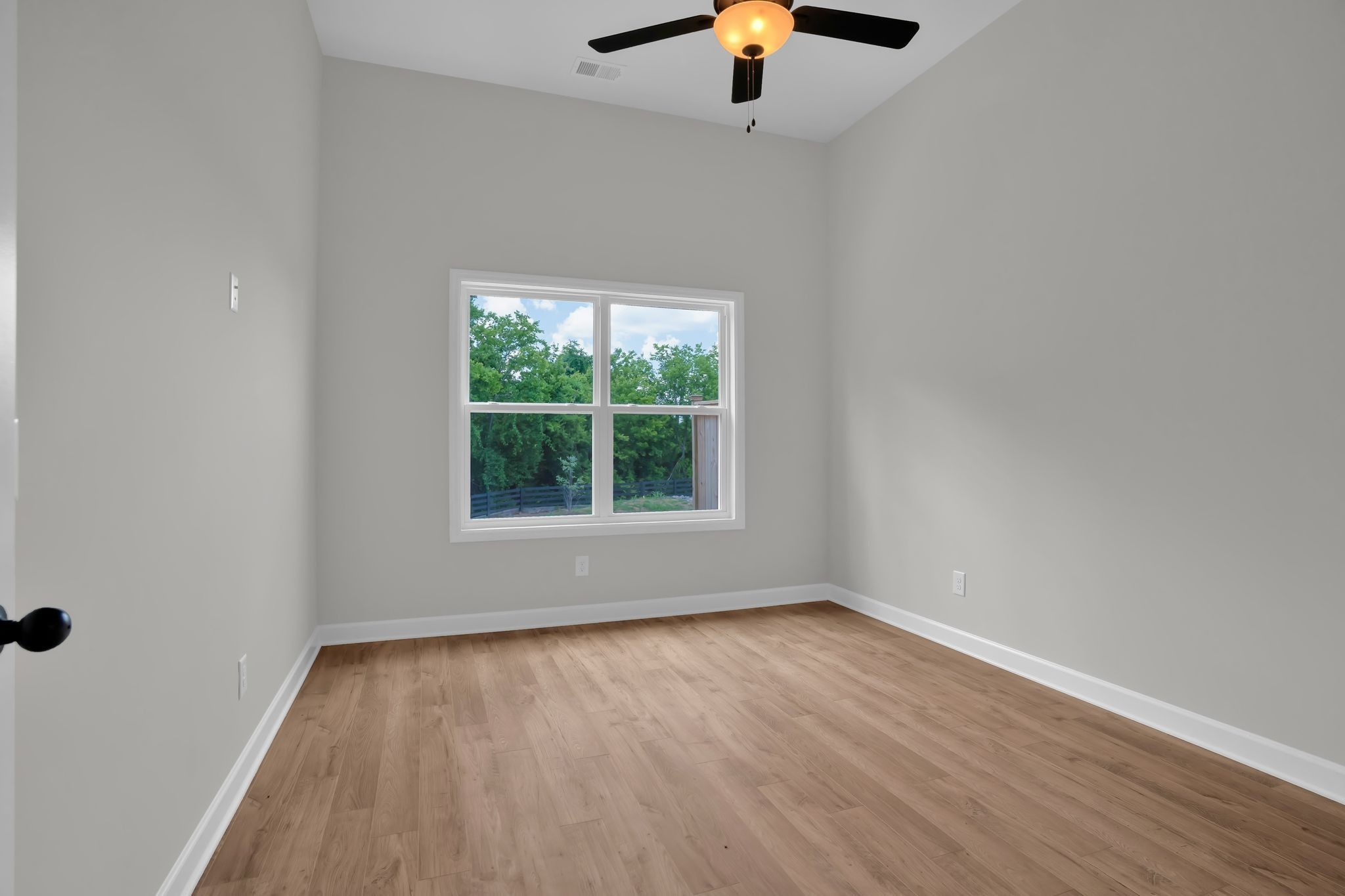159 Rothwood Pvt Drive Hendersonville, TN 37075 - Photo 15 of 33 an empty room with a window and wooden floor