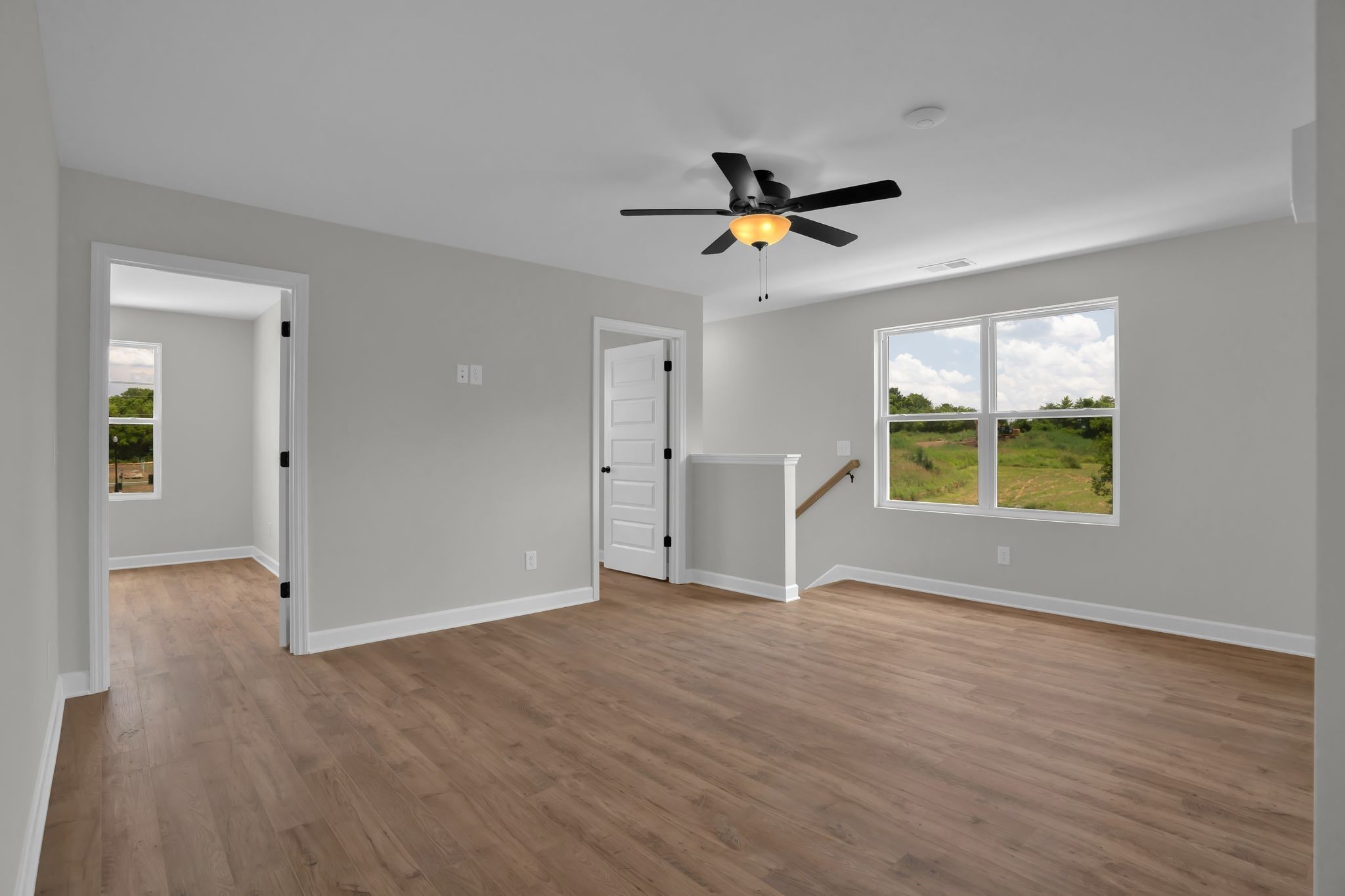 159 Rothwood Pvt Drive Hendersonville, TN 37075 - Photo 21 of 33 an empty room with wooden floor and windows
