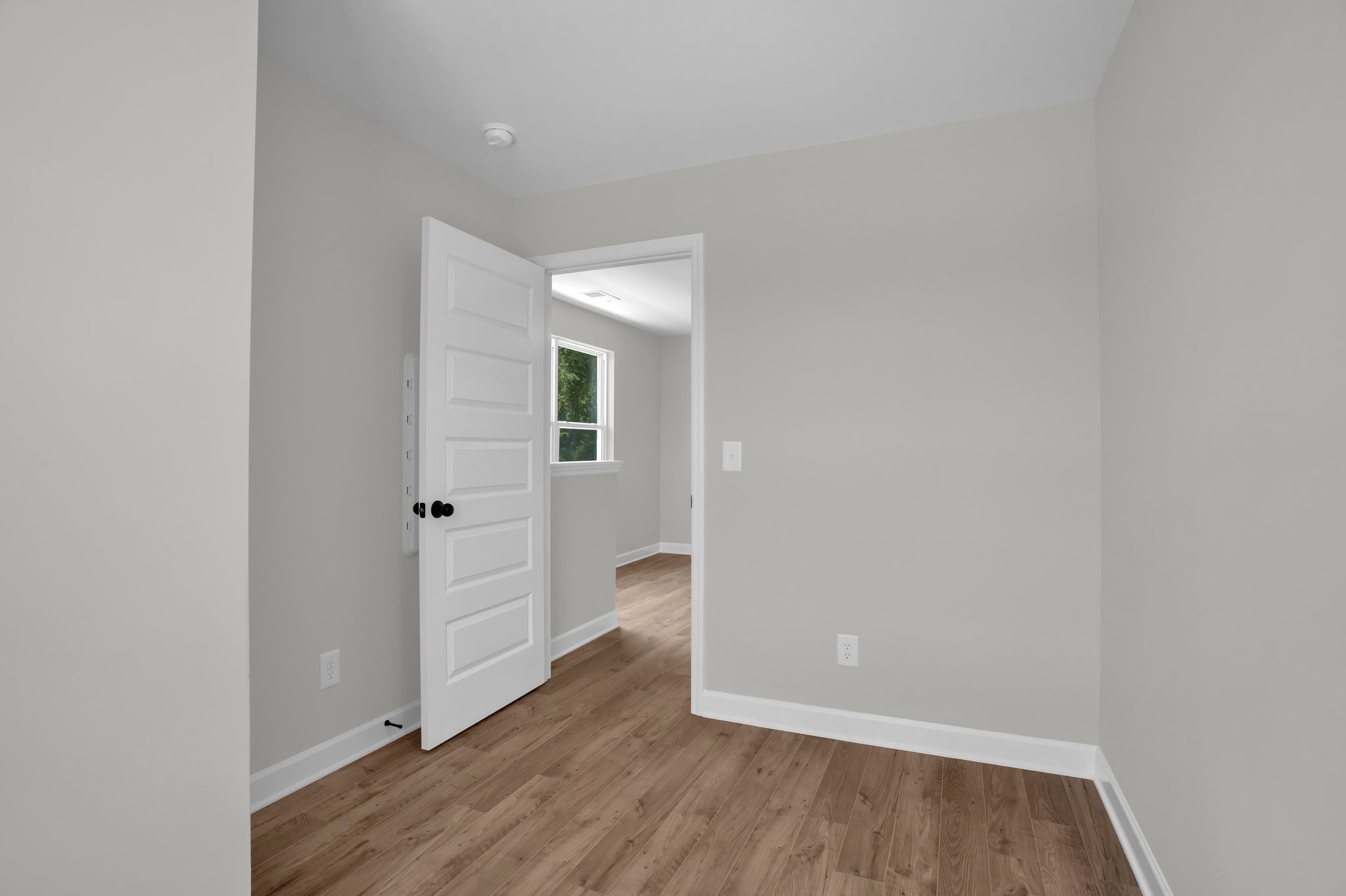 159 Rothwood Pvt Drive Hendersonville, TN 37075 - Photo 23 of 33 a view of an empty room with wooden floor and a window