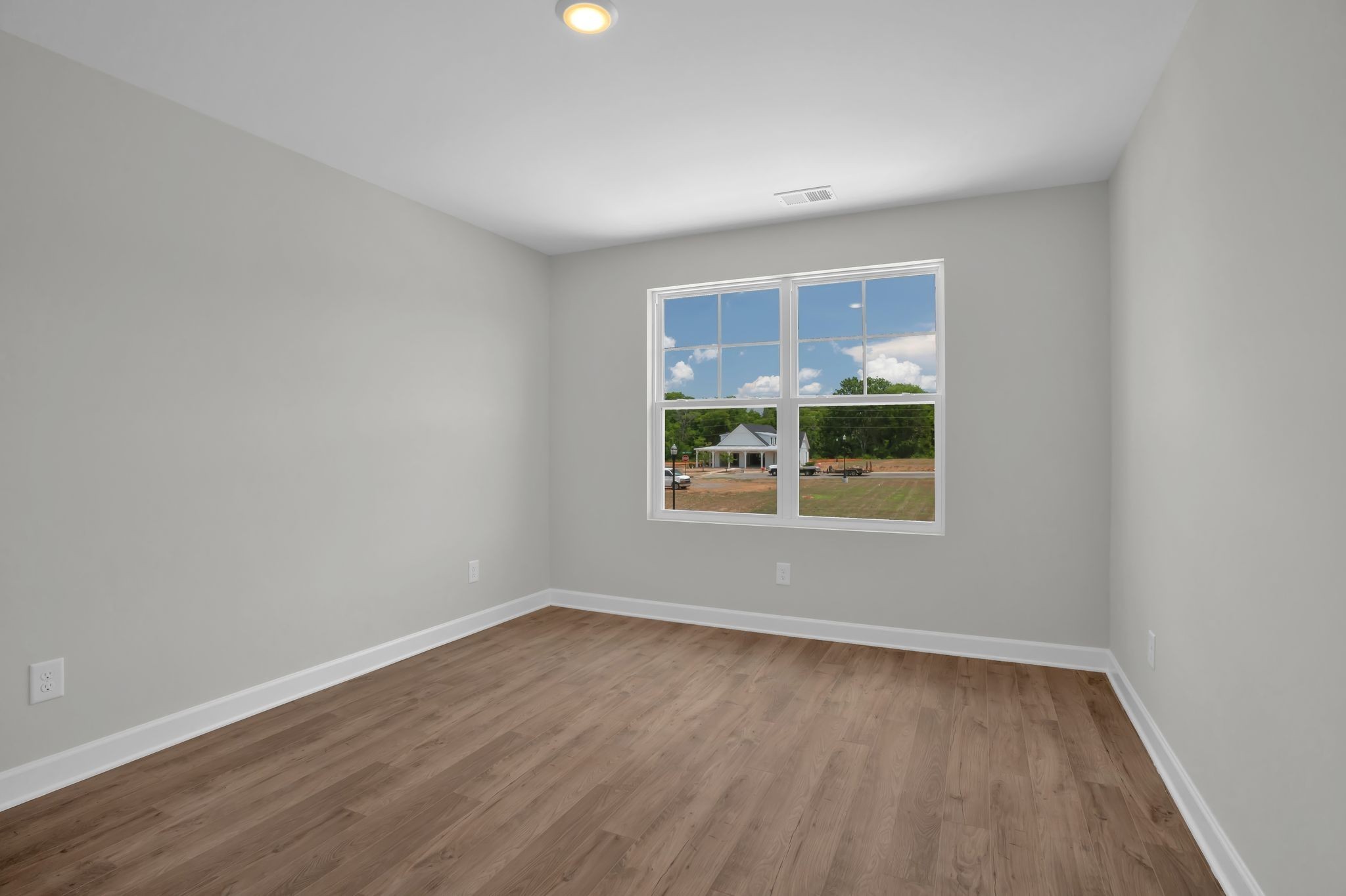 159 Rothwood Pvt Drive Hendersonville, TN 37075 - Photo 24 of 33 a view of an empty room with wooden floor and a window
