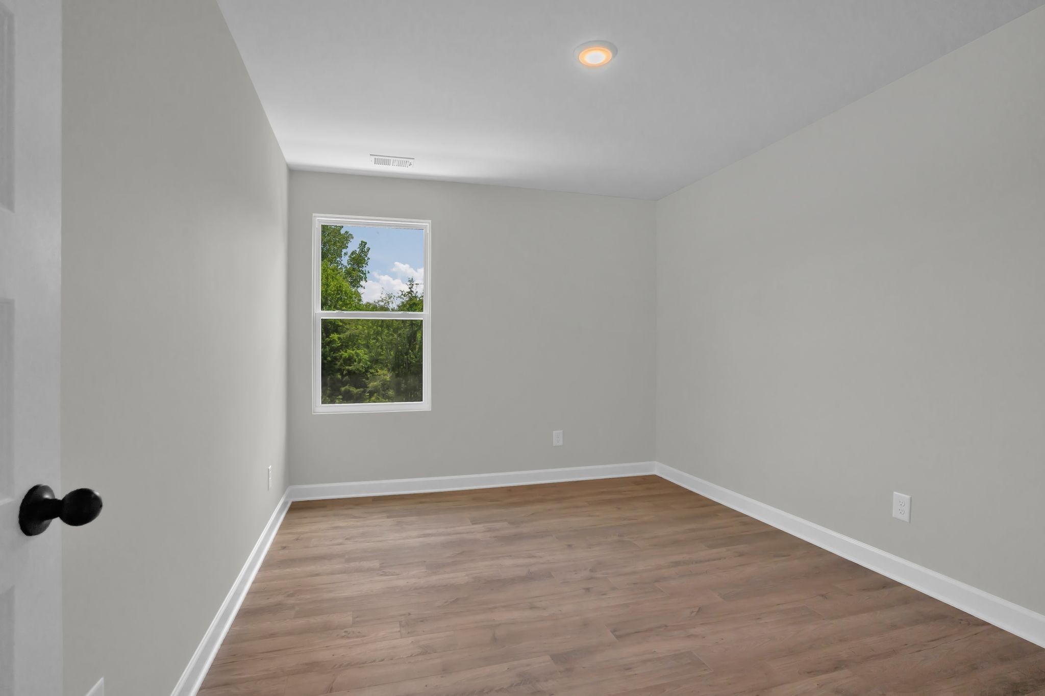 159 Rothwood Pvt Drive Hendersonville, TN 37075 - Photo 29 of 33 wooden floor in an empty room with a window