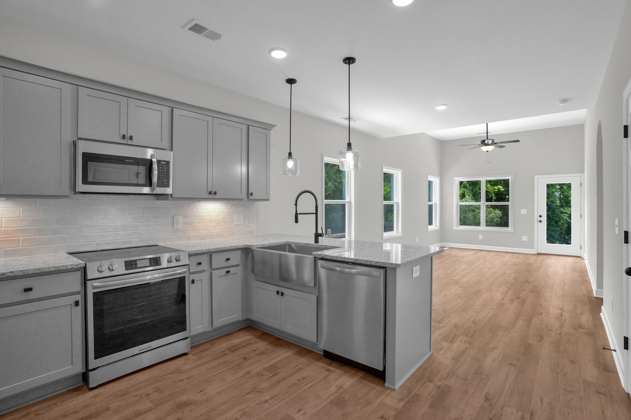 159 Rothwood Pvt Drive Hendersonville, TN 37075 - Photo 8 of 33 a kitchen with stainless steel appliances granite countertop a sink a stove and a wooden floors