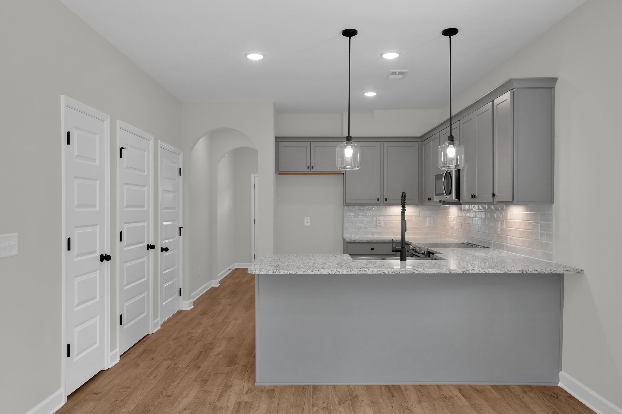 159 Rothwood Pvt Drive Hendersonville, TN 37075 - Photo 9 of 33 a large kitchen with stainless steel appliances kitchen island a large island a chimney a sink and a window