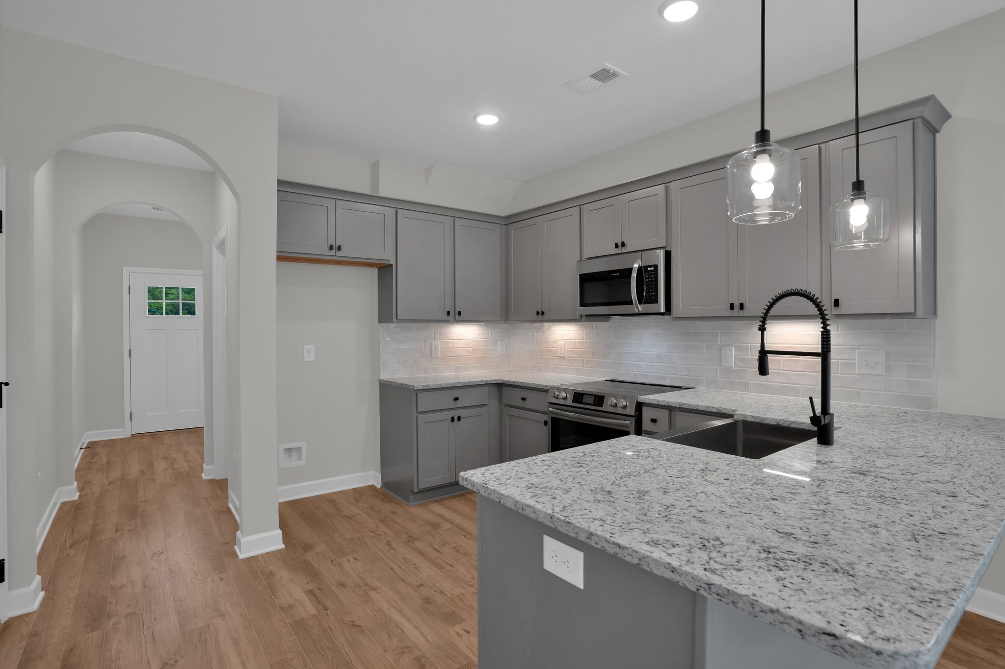 159 Rothwood Pvt Drive Hendersonville, TN 37075 - Photo 10 of 33 a kitchen with stainless steel appliances granite countertop a sink a stove and a refrigerator