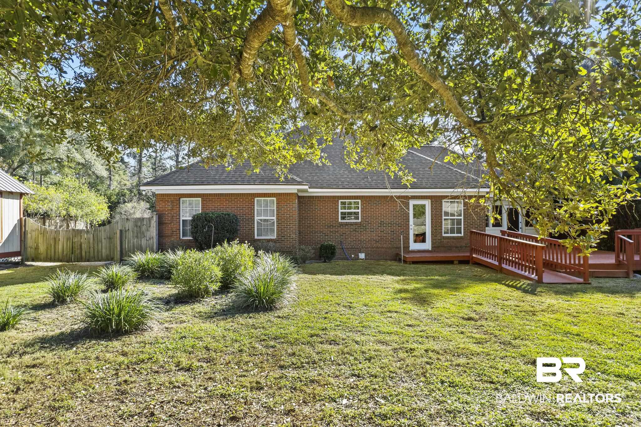 9631 Bay Meadows Avenue Fairhope, AL 36532 - Photo 40 of 49 Rear view of property featuring a lawn and a deck