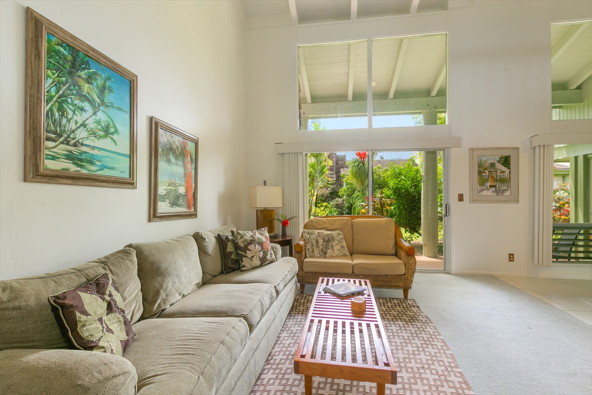 3880 Wyllie Road, Unit 8C Princeville, HI 96722 - Photo 1 of 17 a living room with furniture and a window