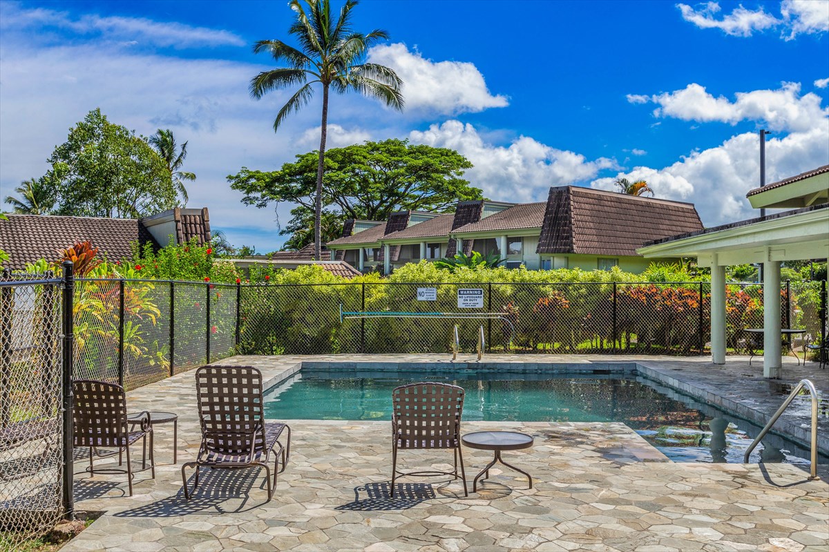 3880 Wyllie Road, Unit 8C Princeville, HI 96722 - Photo 16 of 17 a view of a chair and tables in the patio