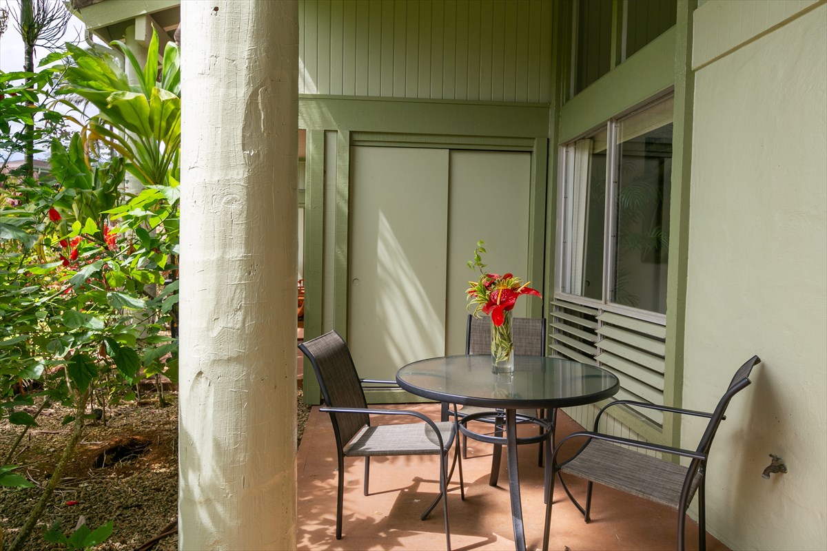 3880 Wyllie Road, Unit 8C Princeville, HI 96722 - Photo 5 of 17 a view of a dining room with furniture and wooden floor