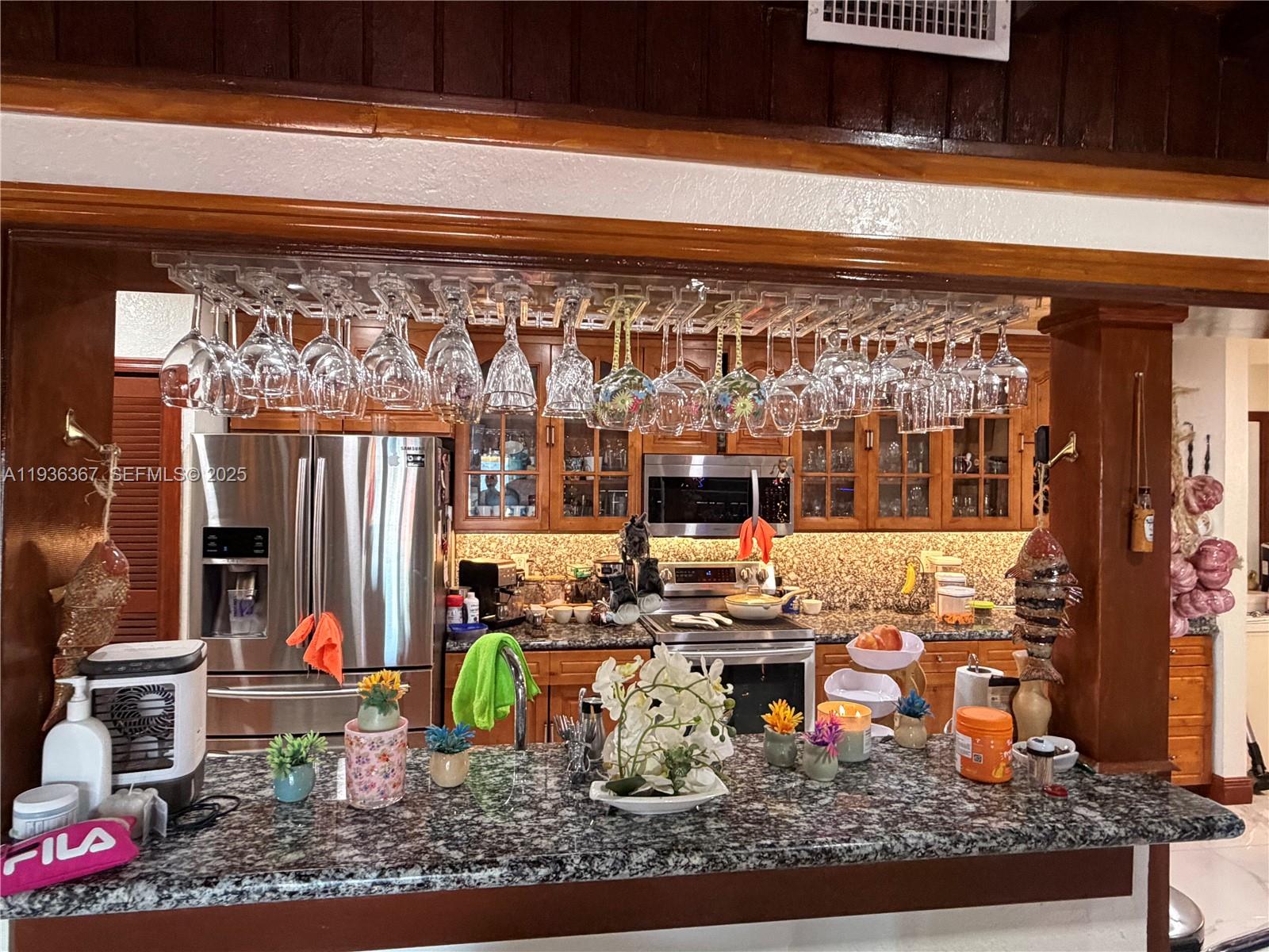 15022 Southwest 67th Lane Miami, FL 33193 - Photo 14 of 34 a living room filled with furniture