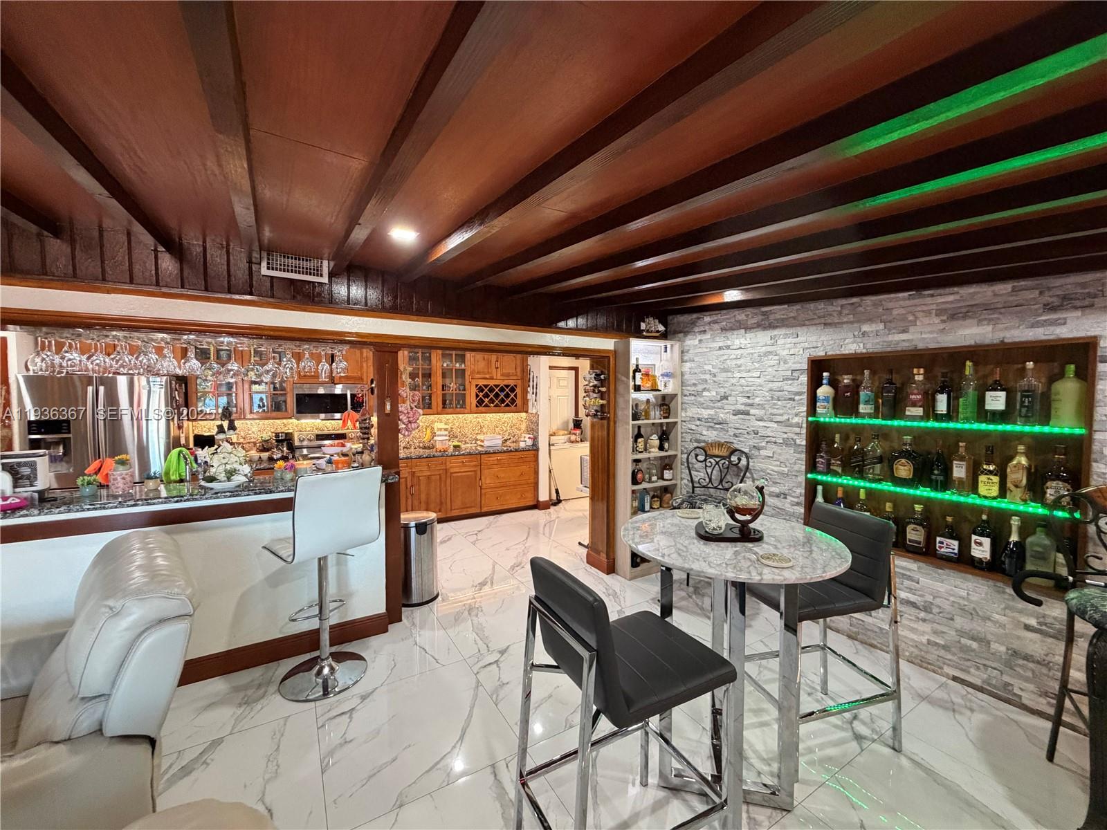 15022 Southwest 67th Lane Miami, FL 33193 - Photo 20 of 34 a room with lots of furniture and a painting on the wall