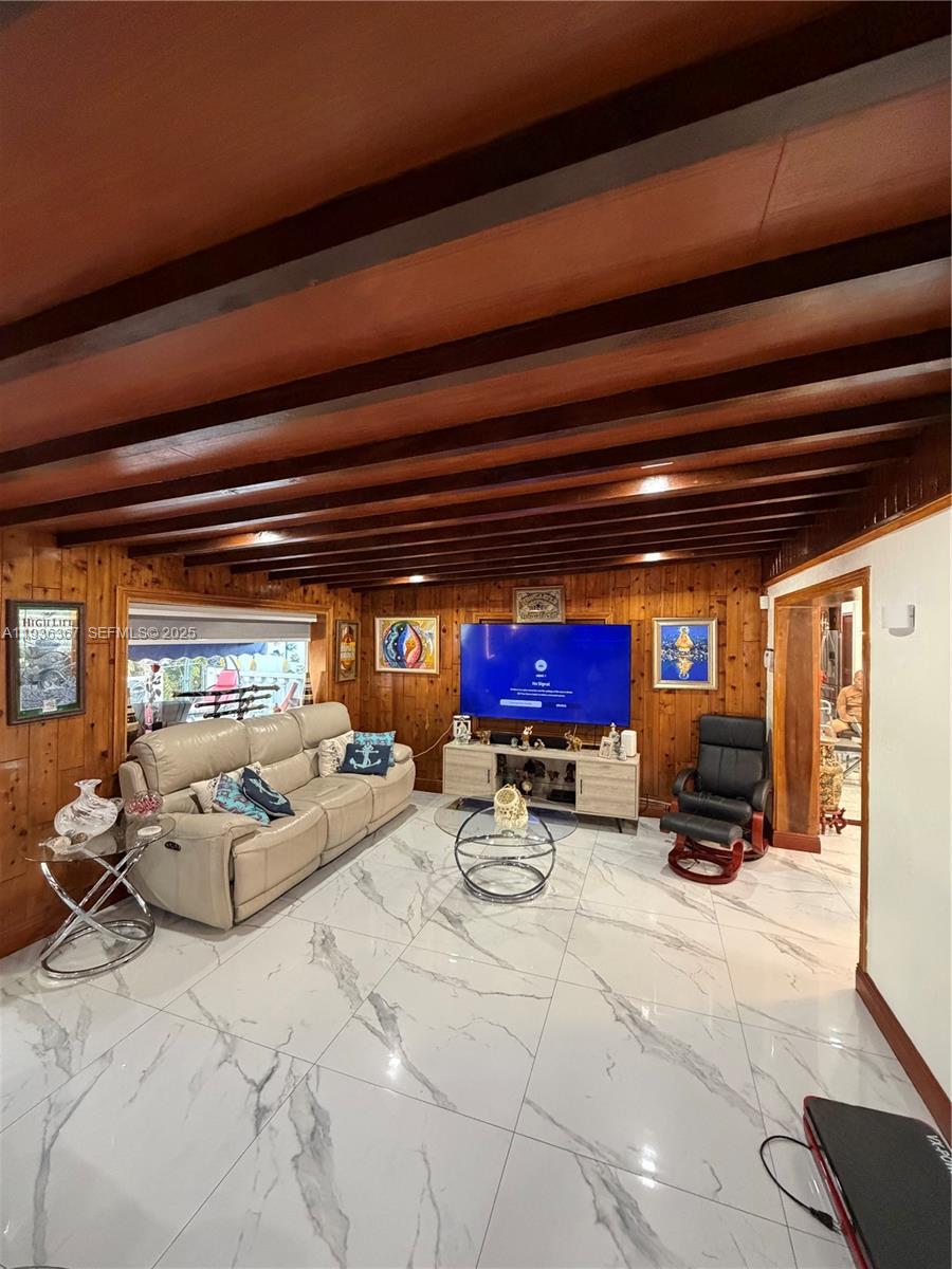 15022 Southwest 67th Lane Miami, FL 33193 - Photo 21 of 34 a sitting area with furniture and a potted plant