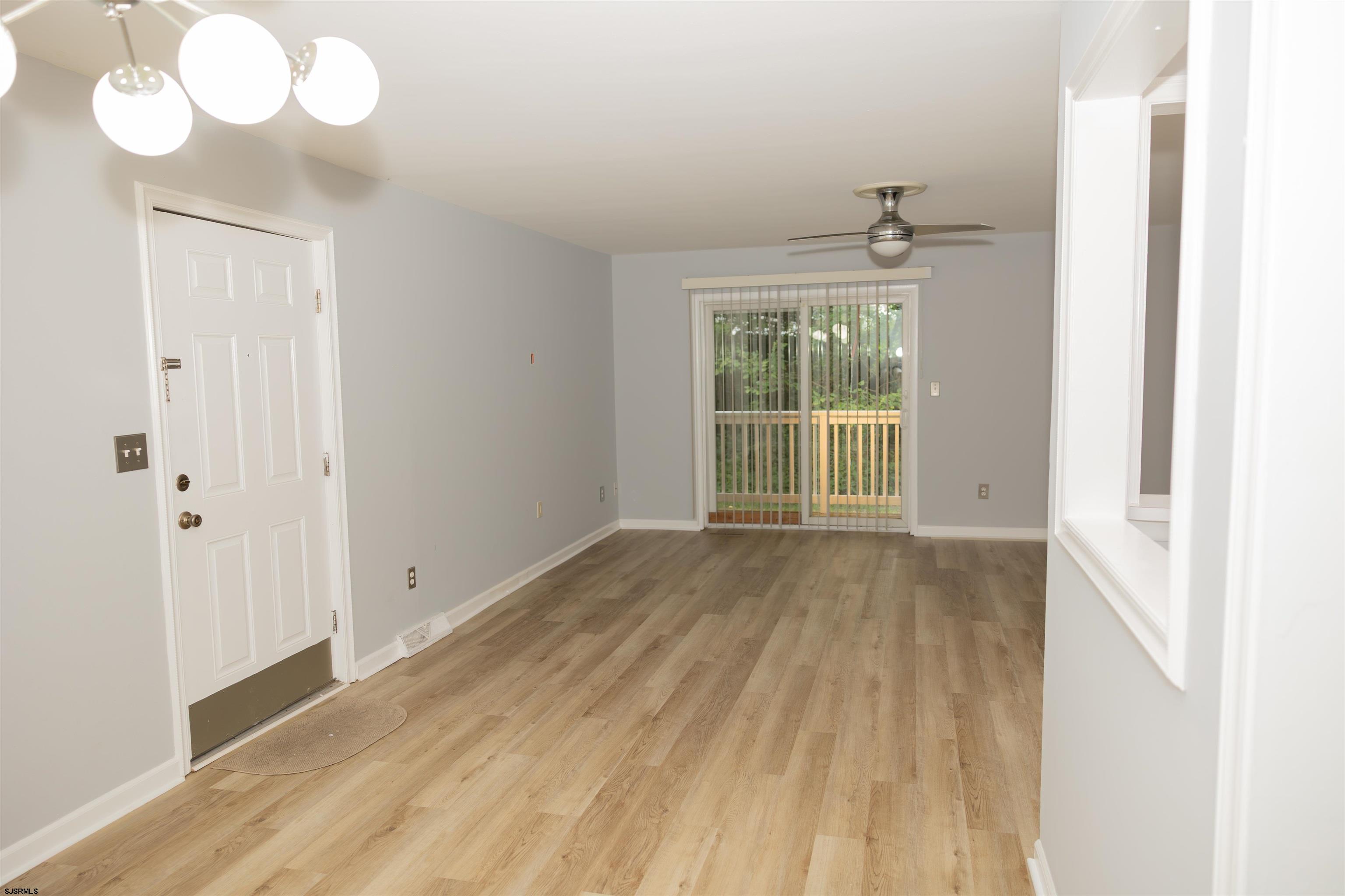 2 Oyster Bay Road, Unit 2D Absecon, NJ 08205 - Photo 16 of 26 a view of an empty room with a window