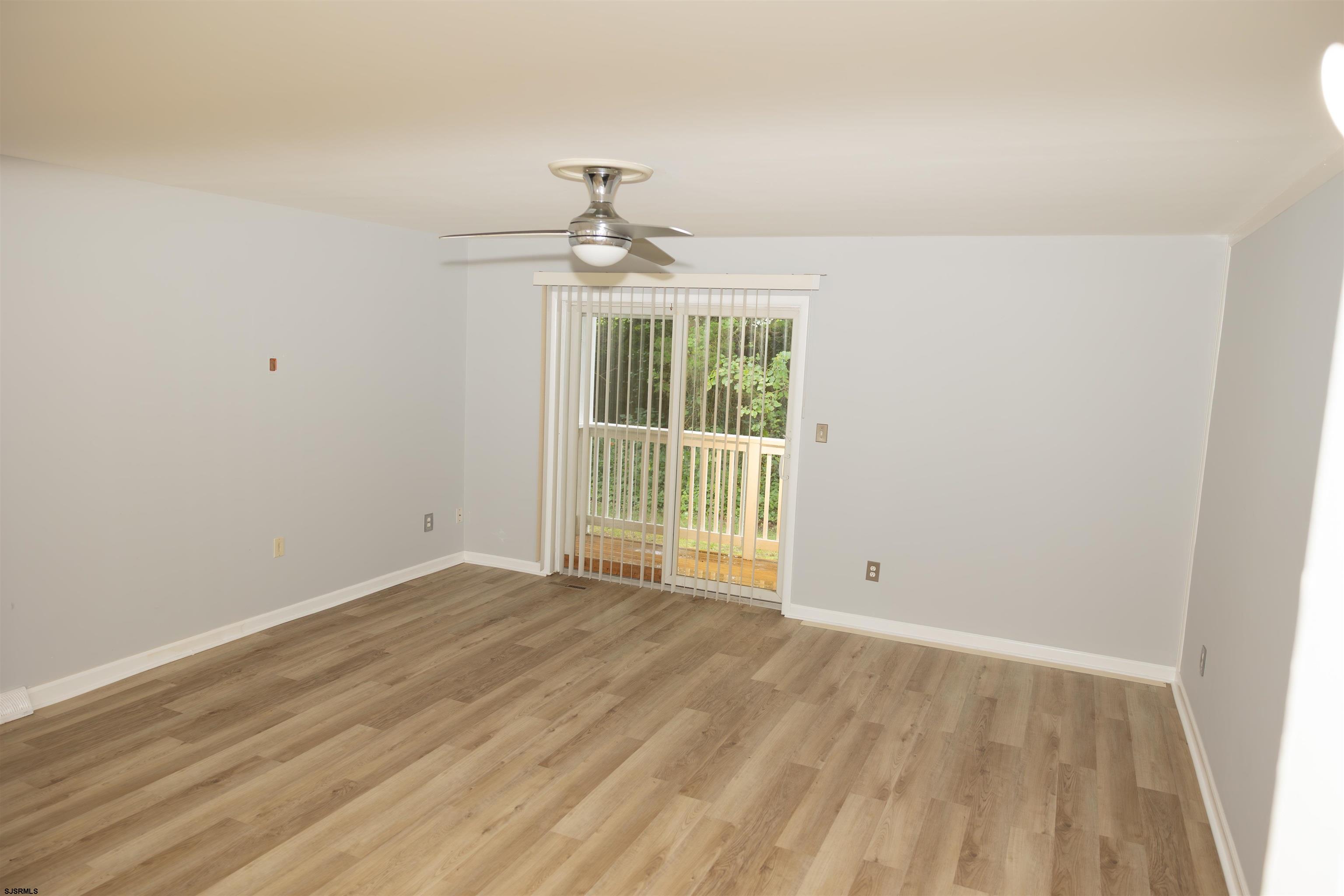 2 Oyster Bay Road, Unit 2D Absecon, NJ 08205 - Photo 17 of 26 wooden floor in an empty room