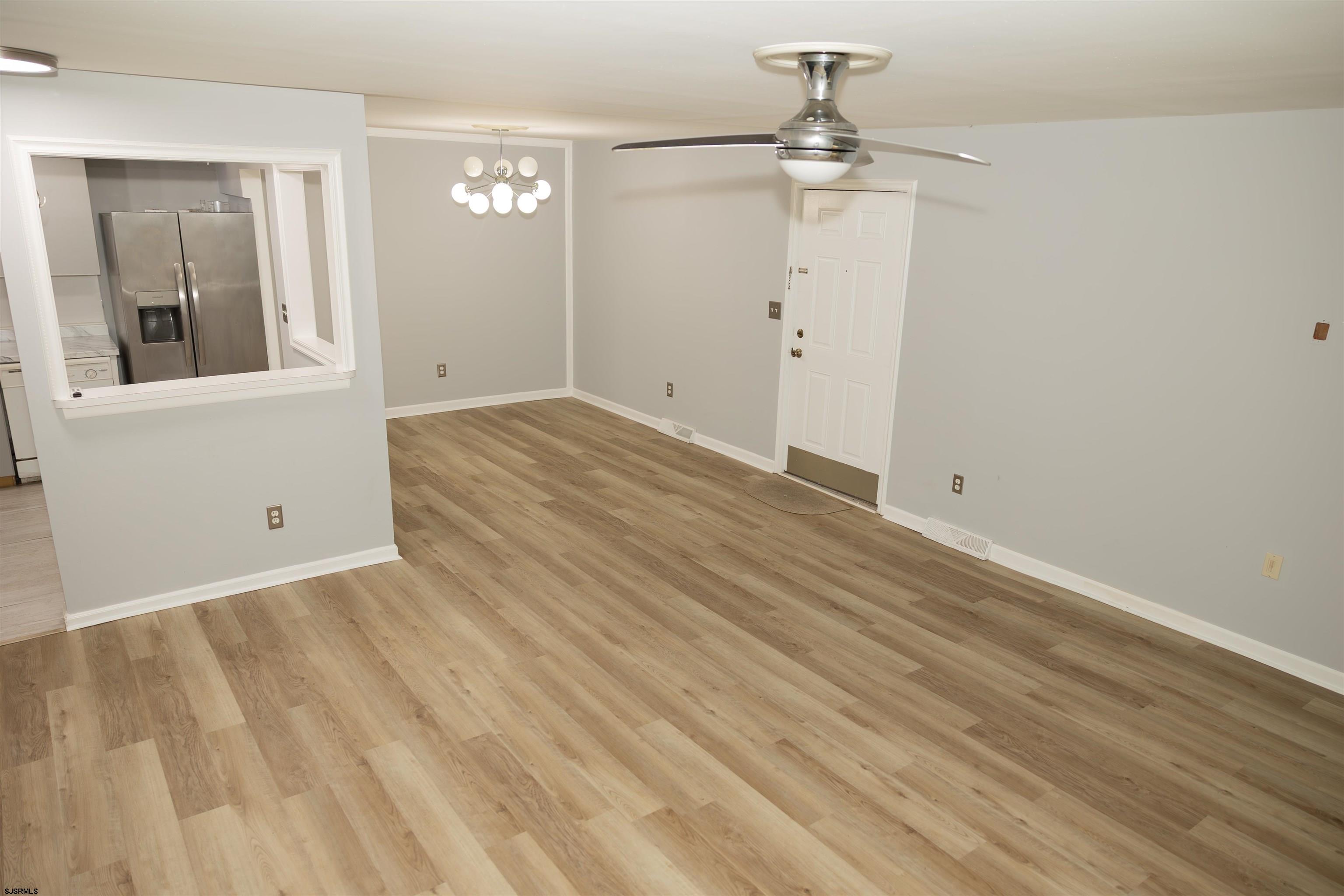 2 Oyster Bay Road, Unit 2D Absecon, NJ 08205 - Photo 19 of 26 wooden floor in an empty room