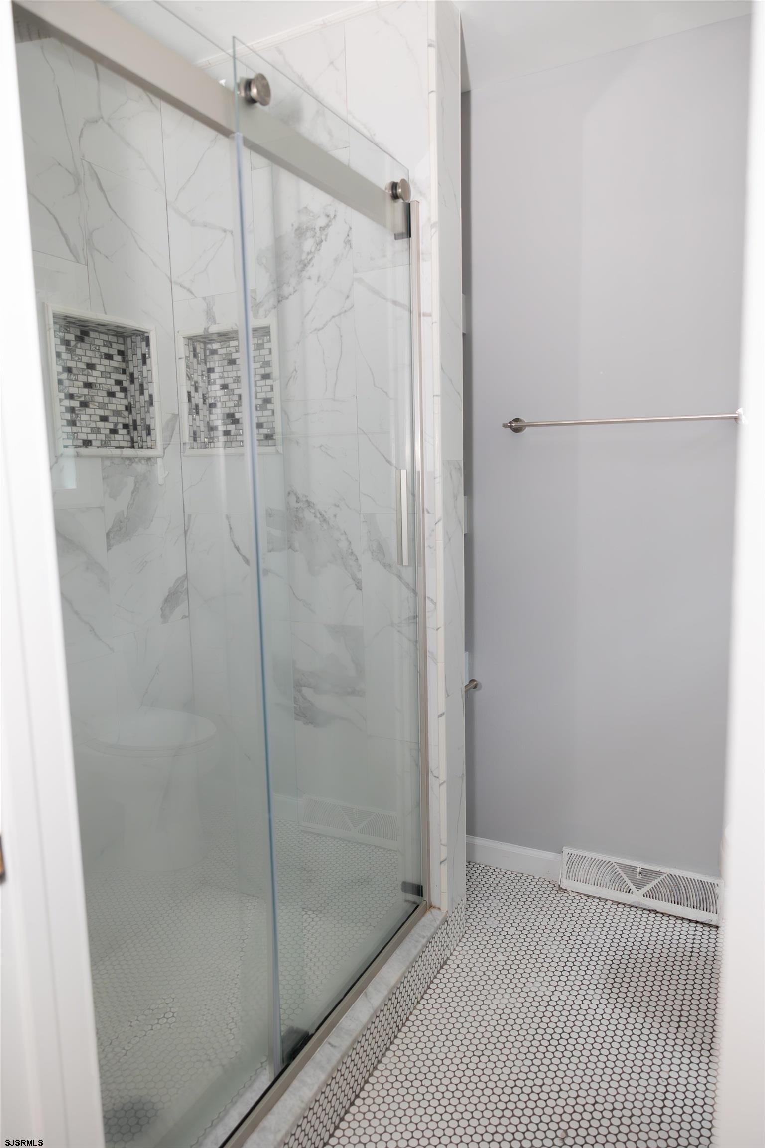 2 Oyster Bay Road, Unit 2D Absecon, NJ 08205 - Photo 9 of 26 a bathroom with a shower