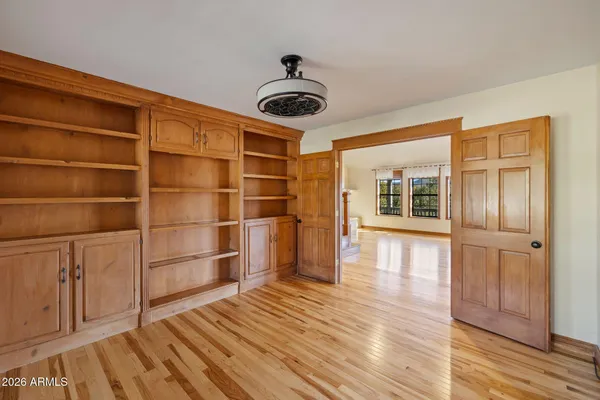 a bathroom with a shower curtain and a window