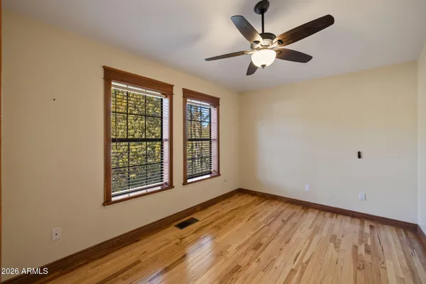 a view of balcony with wooden floor and city view