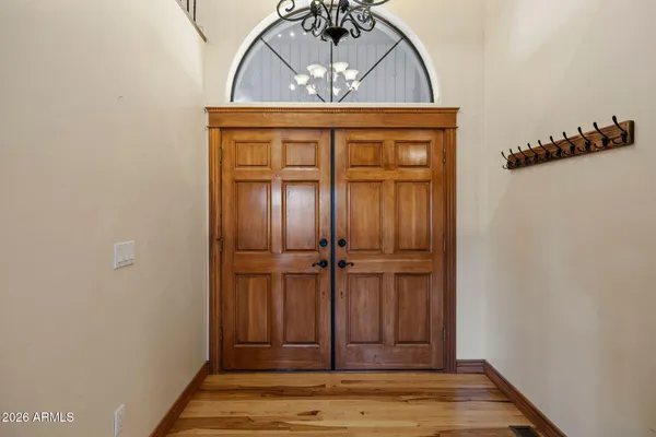 a view of an entryway with wooden floor