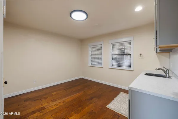 an aerial view of a house with a mountain