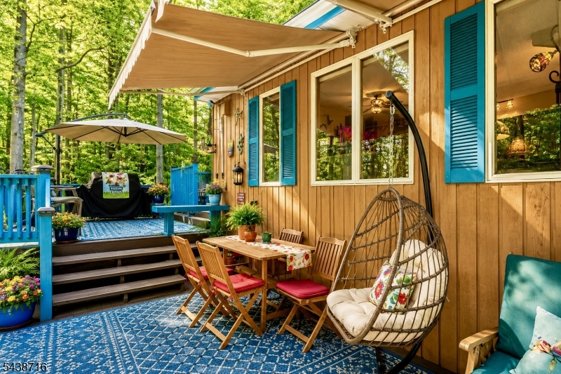 11 Rippling Brook Drive Vernon, NJ 07422 - Photo 42 of 49 a backyard of a house with barbeque oven table and chairs