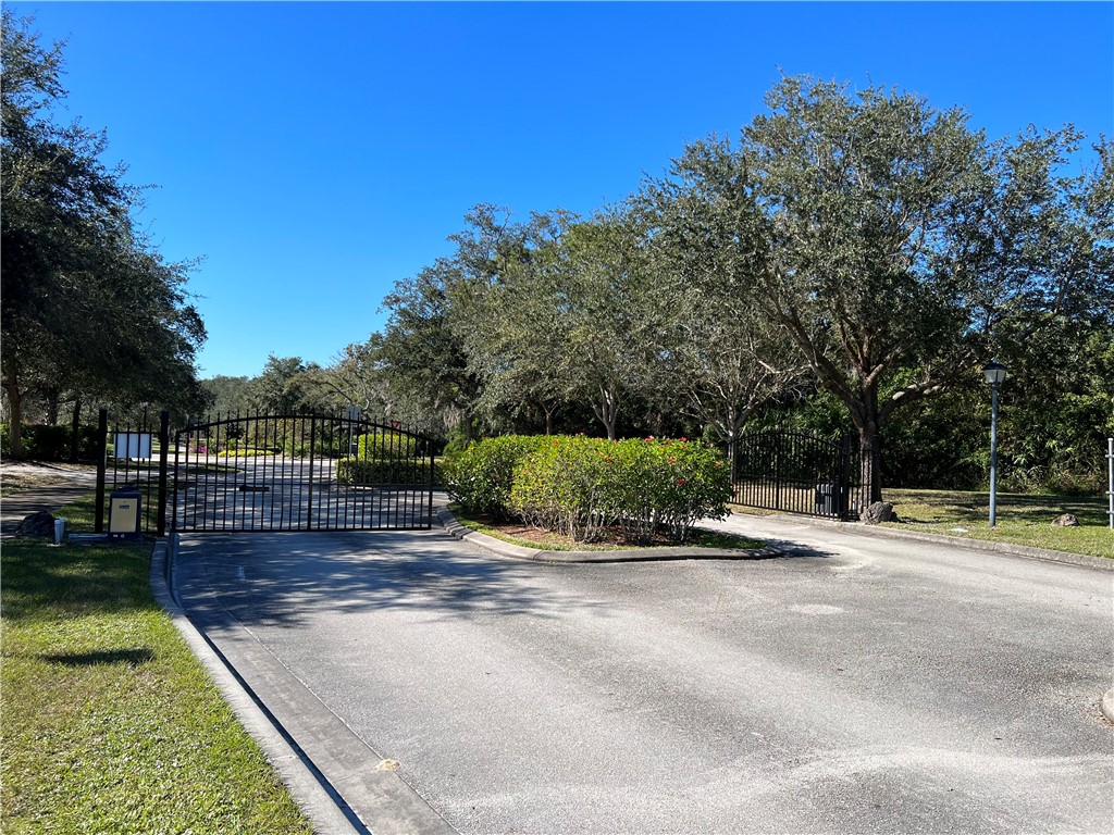 11324 Ganesh Way Sebastian, FL 32958 - Photo 2 of 15 a view of a park with large trees