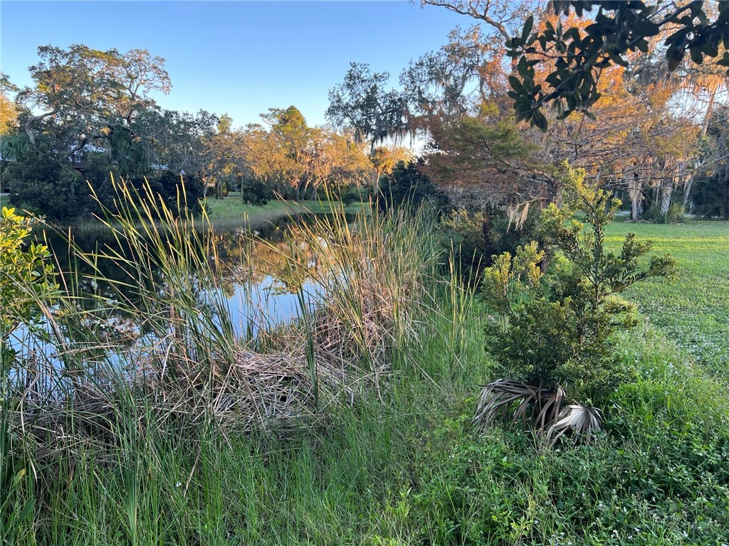 11324 Ganesh Way Sebastian, FL 32958 - Photo 6 of 15 a view of a lake view with houses in back