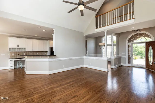a view of an entryway with wooden floor