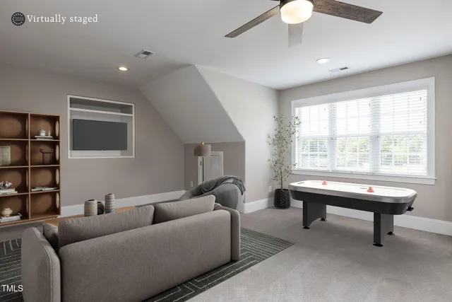 a living room with furniture a lamp and a window