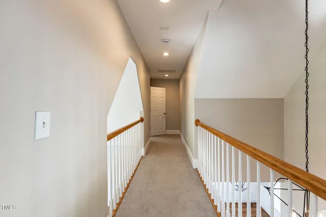 a view of a hallway with staircase